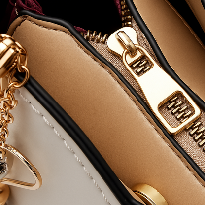 Bolsa Melvie Vie Crossbody con Asa Dorada