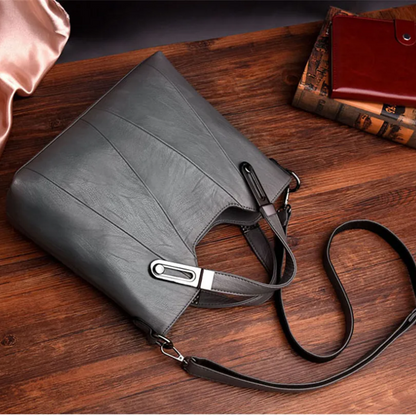 Bolsa de Mano en Cuero con Asa Ajustable